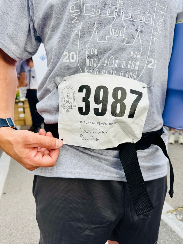 Jared with Race bib showing names of family who passed he is running for. 