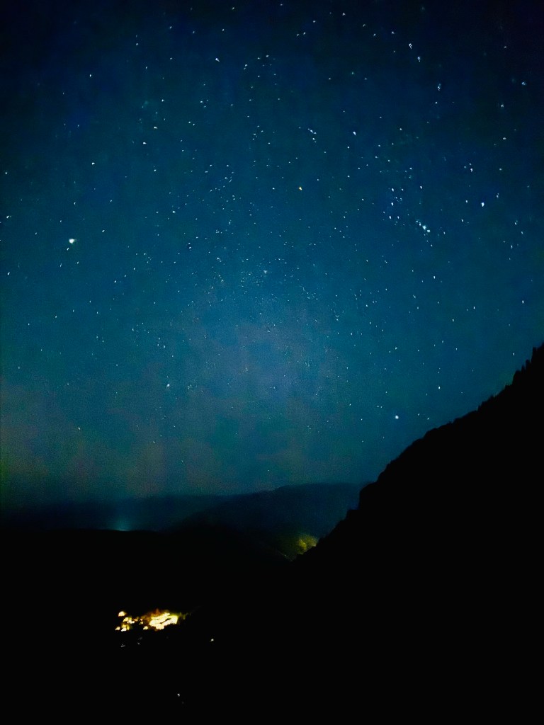 Starry night sky with planets Venus and Jupiter hiking to the top of Mount Timpanogos 