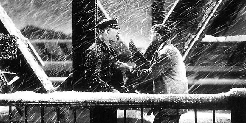 George Bailey holding out Zulu’s petals to Burt the Policeman