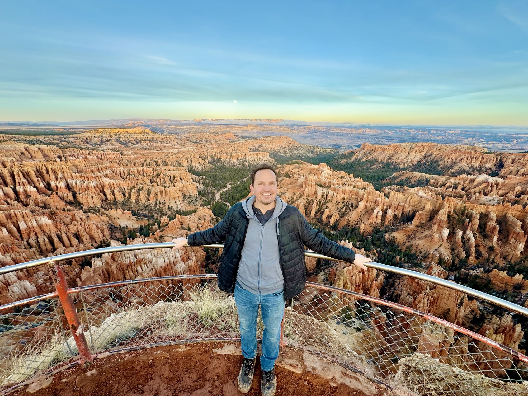 Jared Harding Wilson at Upper Inspiration Point - Bryce Canyon - Hoodoos and a Full Moon behind.