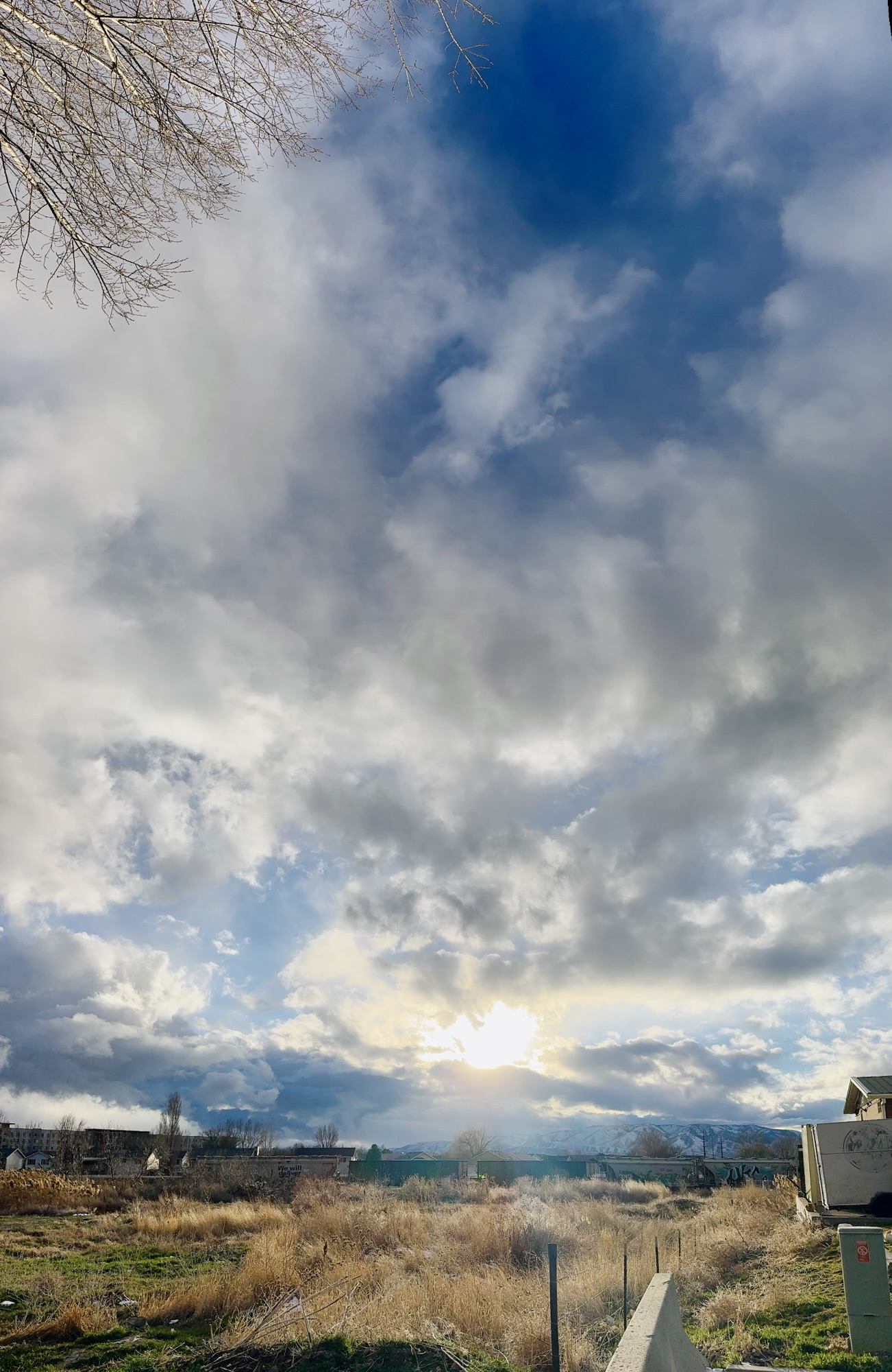 A vertical shot of dramatic sunset clouds and brilliant light captured by Jared Harding Wilson.