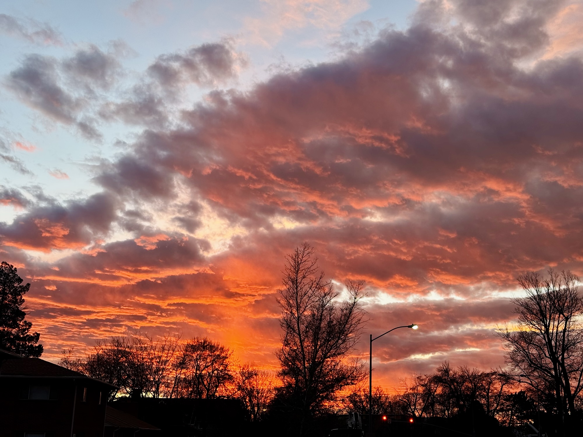 An intense Utah sky filled with vibrant pink, orange, and purple sunset clouds, photographed by Jared Harding Wilson.