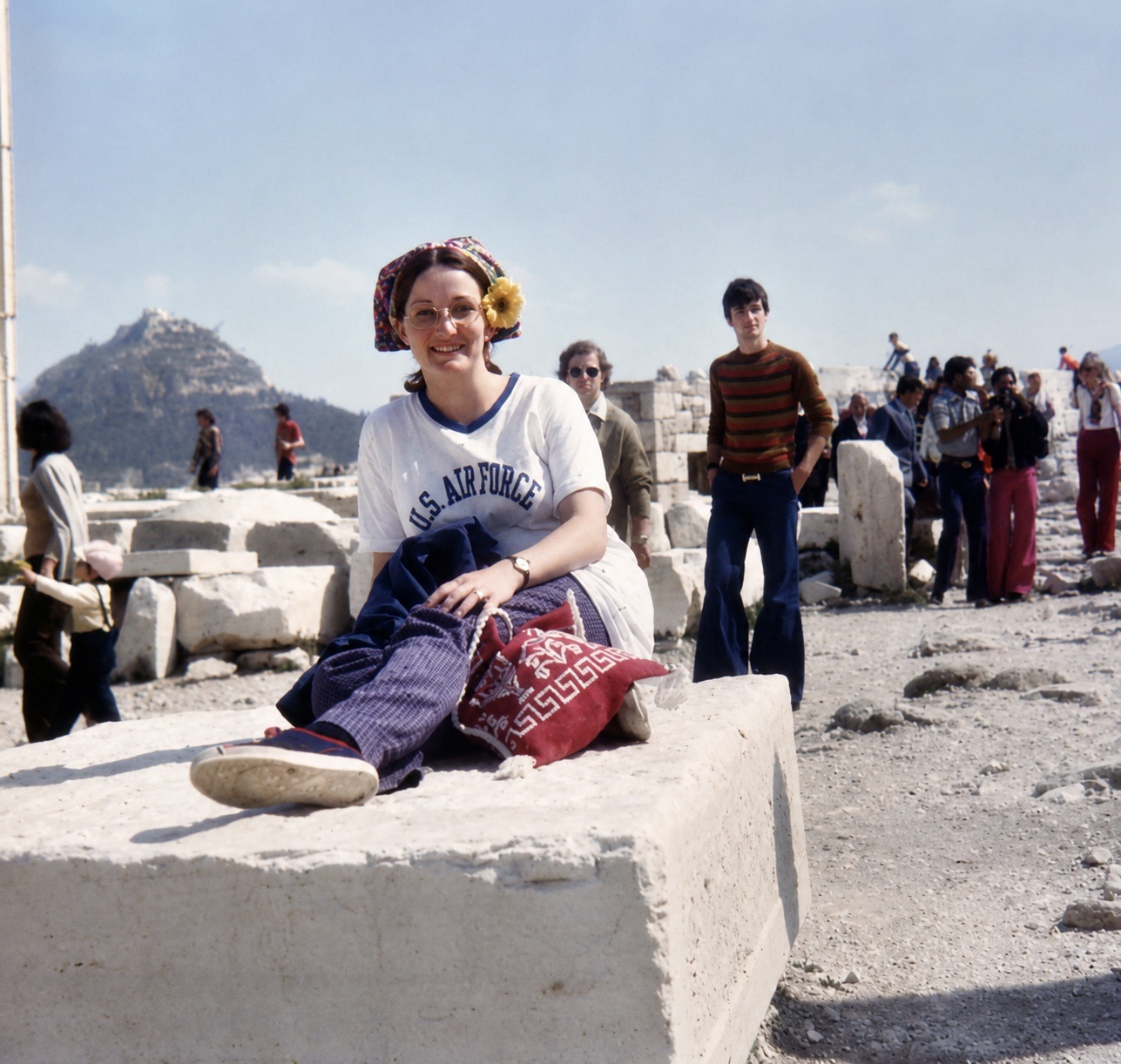 A young woman in casual clothing posing among historic ancient stone ruins during a military R&R trip in Turkey. Photograph from the collection of Jared Harding Wilson.