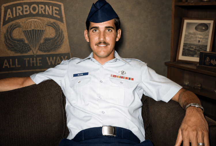 A young Larry Wilson smiling in his blue Air Force uniform and wedge hat, captured in a historic family photograph by Jared Harding Wilson.