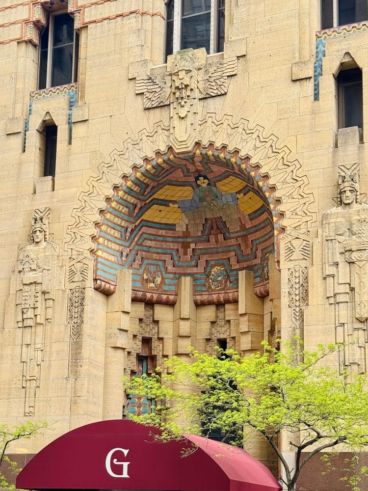 A detailed close-up of the vibrant decorative tile alcove and stone carvings outside the Guardian Building, documented on a architecture walk by Jared Harding Wilson.